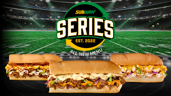Three subs with football field in the background.