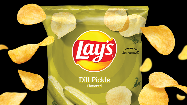 Bag of Dill Chips with chips falling around it.